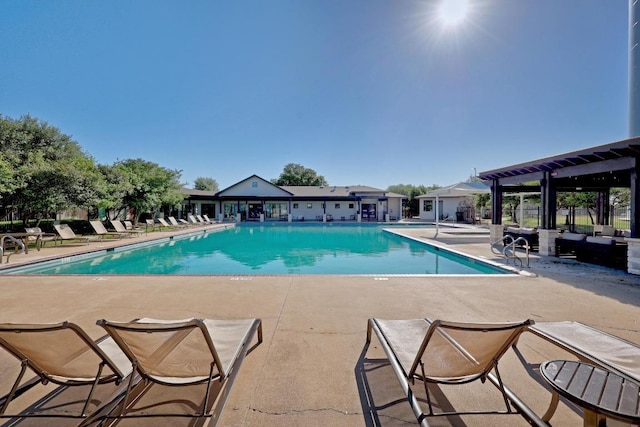 community pool with a patio area