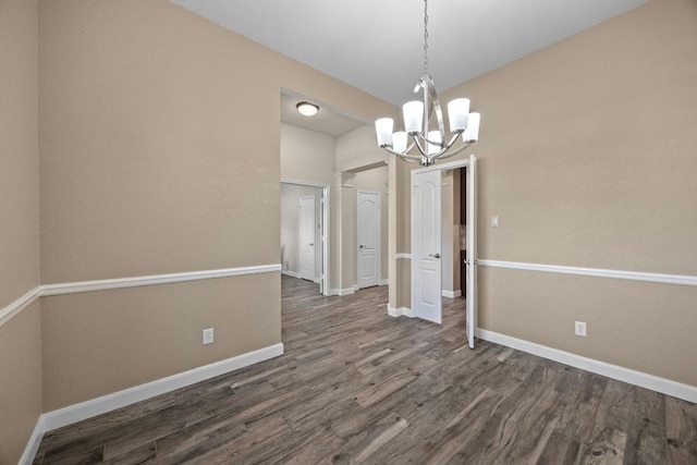 1517 Cherokee Run, Pflugerville, TX 78660 - unfurnished dining area featuring dark wood finished floors, a chandelier, and baseboards