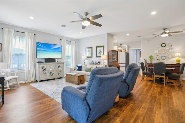 103 Bonham Ln, Paige, TX 78659 - living room featuring a ceiling fan, wood finished floors, healthy amount of natural light, and recessed lighting