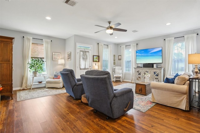 103 Bonham Ln, Paige, TX 78659 - living area with dark wood finished floors, a ceiling fan, healthy amount of natural light, recessed lighting, and baseboards
