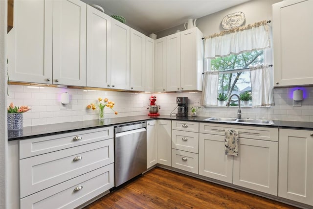 103 Bonham Ln, Paige, TX 78659 - kitchen with stainless steel dishwasher, a sink, dark countertops, and backsplash