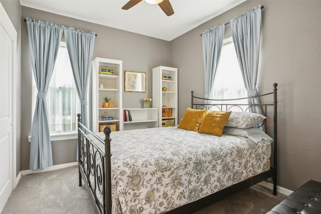 103 Bonham Ln, Paige, TX 78659 - bedroom with carpet, baseboards, and a ceiling fan