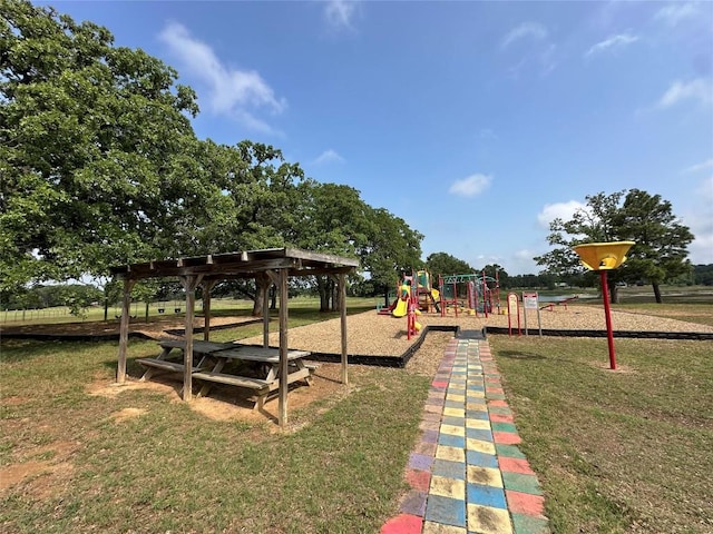103 Bonham Ln, Paige, TX 78659 - community jungle gym with a lawn