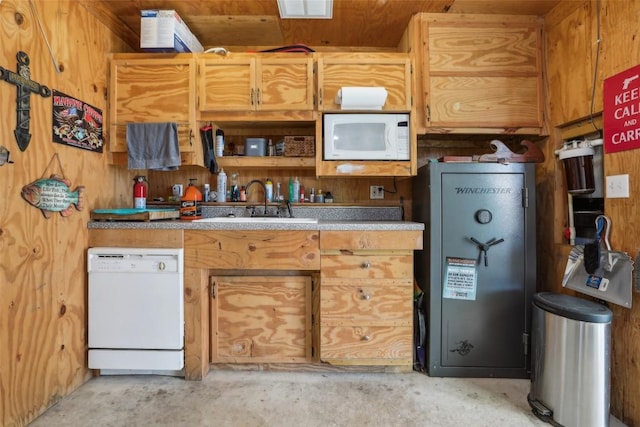 103 Bonham Ln, Paige, TX 78659 - kitchen featuring white appliances, concrete floors, a sink, and wooden walls