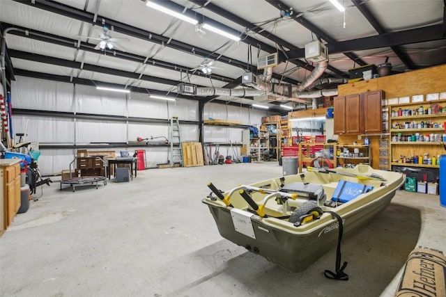 103 Bonham Ln, Paige, TX 78659 - garage with a workshop area and a garage door opener