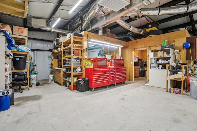 103 Bonham Ln, Paige, TX 78659 - garage featuring a workshop area