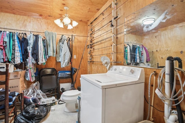 103 Bonham Ln, Paige, TX 78659 - washroom featuring washer / clothes dryer and wood walls