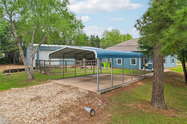 103 Bonham Ln, Paige, TX 78659 - view of car parking with a detached carport and dirt driveway