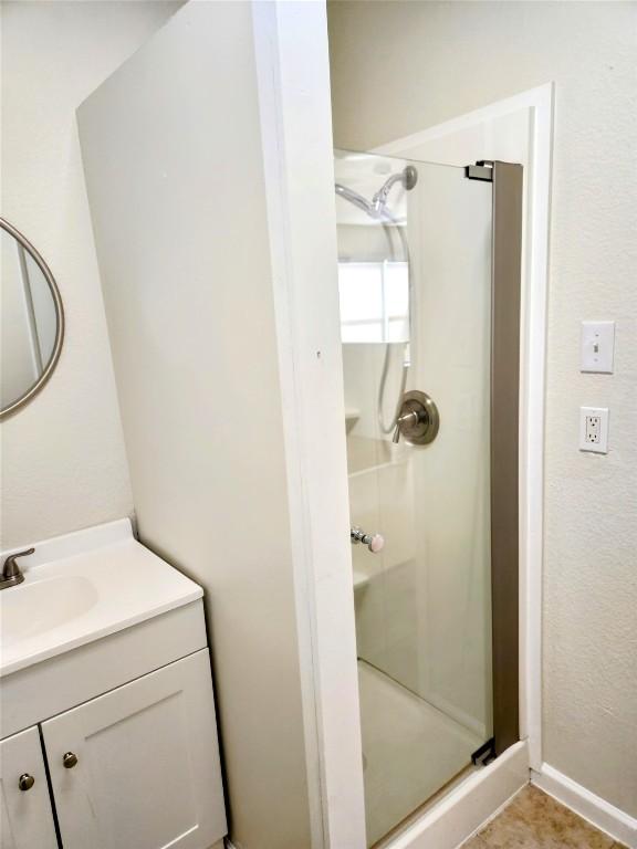 13520 Coomes Dr, Del Valle, TX 78617 - full bath with a shower stall and vanity