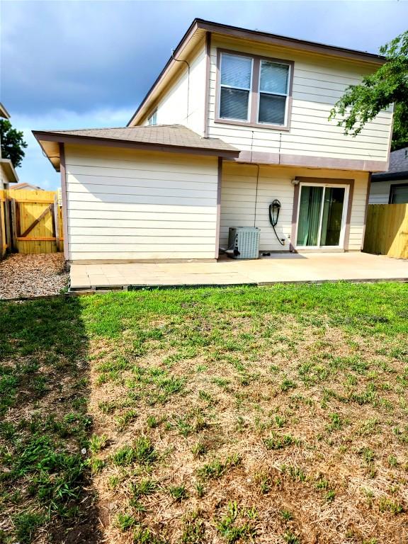 13520 Coomes Dr, Del Valle, TX 78617 - rear view of property featuring a patio