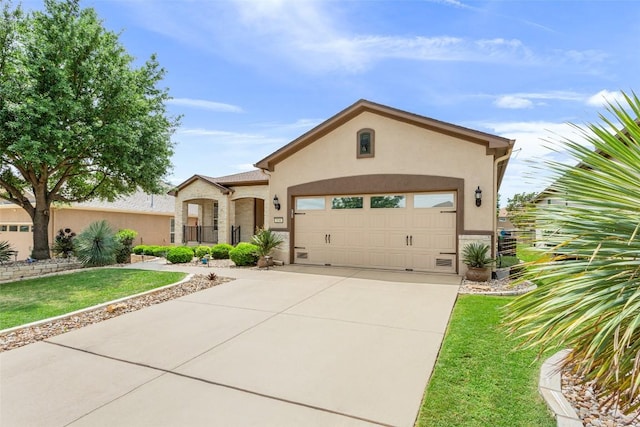 104 Emory Peak Trl, Georgetown, TX 78633 - view of front of home with stucco siding, driveway, an attached garage, and a front lawn
