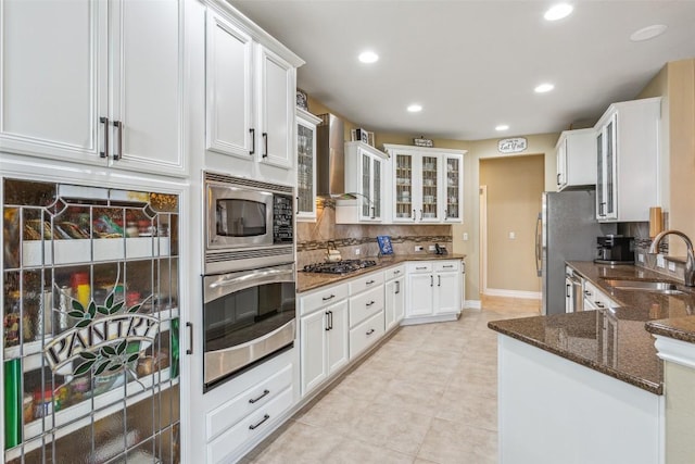 104 Emory Peak Trl, Georgetown, TX 78633 - kitchen featuring stainless steel appliances, tasteful backsplash, white cabinetry, dark stone countertops, and recessed lighting