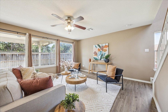 4108 Whitecrest Cv, Round Rock, TX 78681 - living room featuring a ceiling fan, wood finished floors, and a textured ceiling