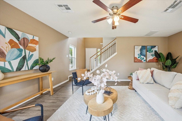 4108 Whitecrest Cv, Round Rock, TX 78681 - living area featuring wood finished floors, stairway, and ceiling fan