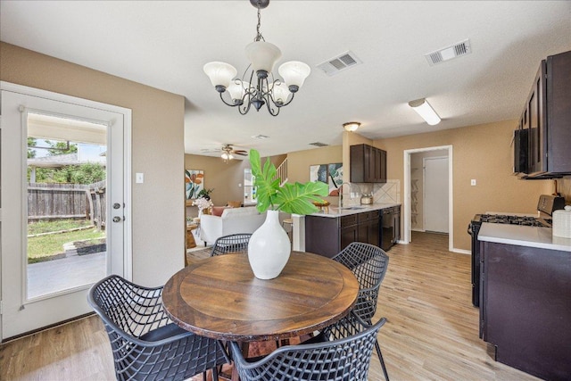 4108 Whitecrest Cv, Round Rock, TX 78681 - dining area with a chandelier, light wood-style floors, and ceiling fan