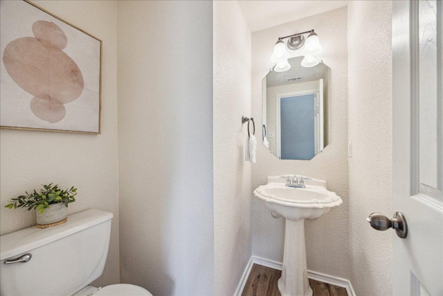4108 Whitecrest Cv, Round Rock, TX 78681 - half bath with toilet and wood finished floors