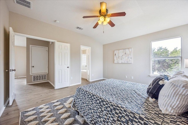 4108 Whitecrest Cv, Round Rock, TX 78681 - bedroom with wood finished floors, connected bathroom, ceiling fan, and lofted ceiling