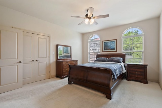 7800 Aspen Highlands Dr, Austin, TX 78746 - bedroom with light carpet, a closet, and a ceiling fan