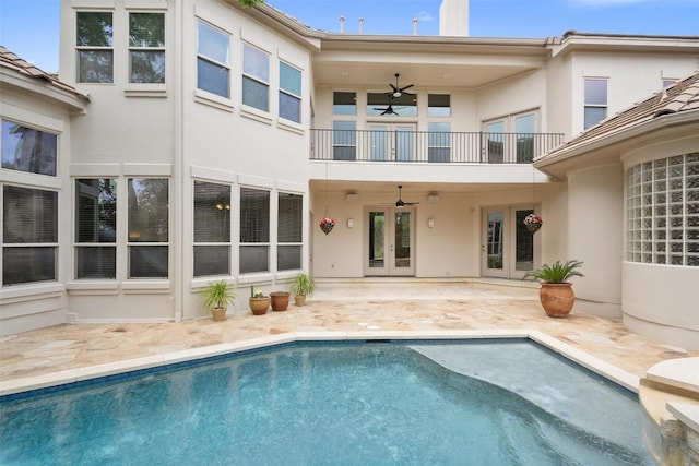 7800 Aspen Highlands Dr, Austin, TX 78746 - rear view of property featuring french doors, a balcony, stucco siding, ceiling fan, and a patio
