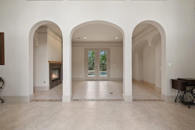 7800 Aspen Highlands Dr, Austin, TX 78746 - interior space featuring french doors, tile patterned flooring, baseboards, a glass covered fireplace, and recessed lighting