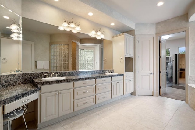 7800 Aspen Highlands Dr, Austin, TX 78746 - full bath with recessed lighting, a sink, tile patterned floors, and double vanity