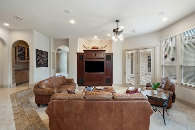 7800 Aspen Highlands Dr, Austin, TX 78746 - living area featuring visible vents, arched walkways, ceiling fan, and recessed lighting