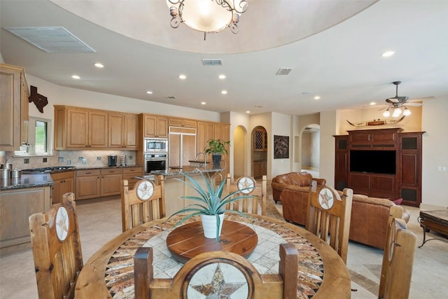 7800 Aspen Highlands Dr, Austin, TX 78746 - dining area with arched walkways, recessed lighting, and ceiling fan