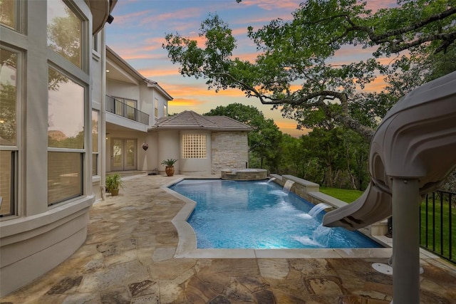 7800 Aspen Highlands Dr, Austin, TX 78746 - outdoor pool with a water slide and a patio area