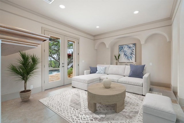 7800 Aspen Highlands Dr, Austin, TX 78746 - living area with arched walkways, french doors, recessed lighting, light tile patterned floors, and ornamental molding