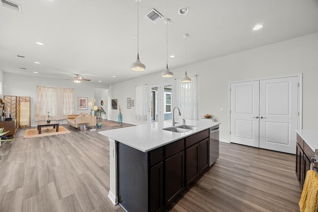 7901 Donnelley Dr, Austin, TX 78744 - kitchen with visible vents, ceiling fan, light countertops, and a sink