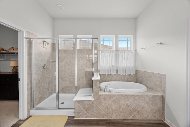 7901 Donnelley Dr, Austin, TX 78744 - bathroom featuring a garden tub and a stall shower