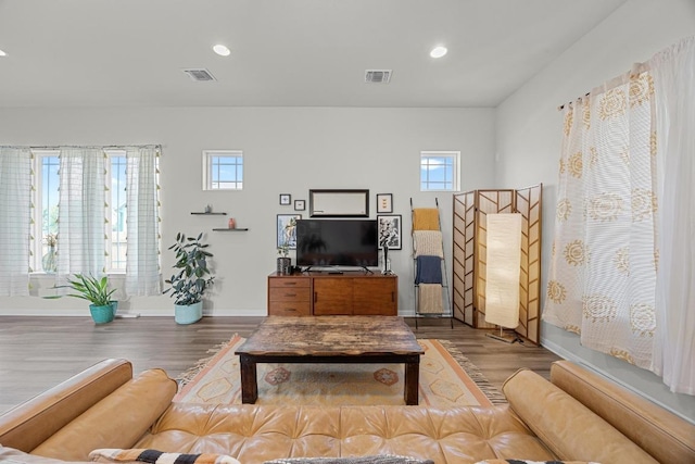 7901 Donnelley Dr, Austin, TX 78744 - living area with visible vents, wood finished floors, and recessed lighting