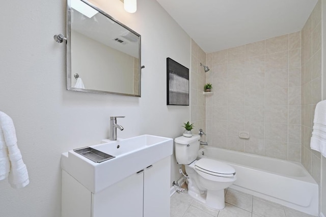 2115 Ann Arbor Ave Unit B, Austin, TX 78704 - full bathroom with vanity, toilet, tile patterned flooring, and washtub / shower combination
