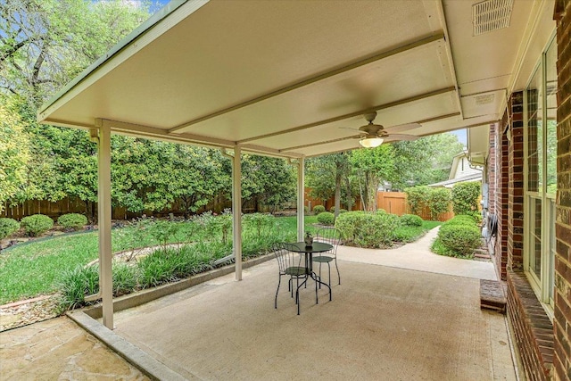 view of patio featuring visible vents, a fenced backyard, and a ceiling fan
