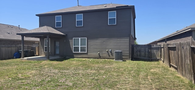 1337 Violet Ln, Kyle, TX 78640 - back of property featuring a lawn, a patio area, central air condition unit, and a fenced backyard