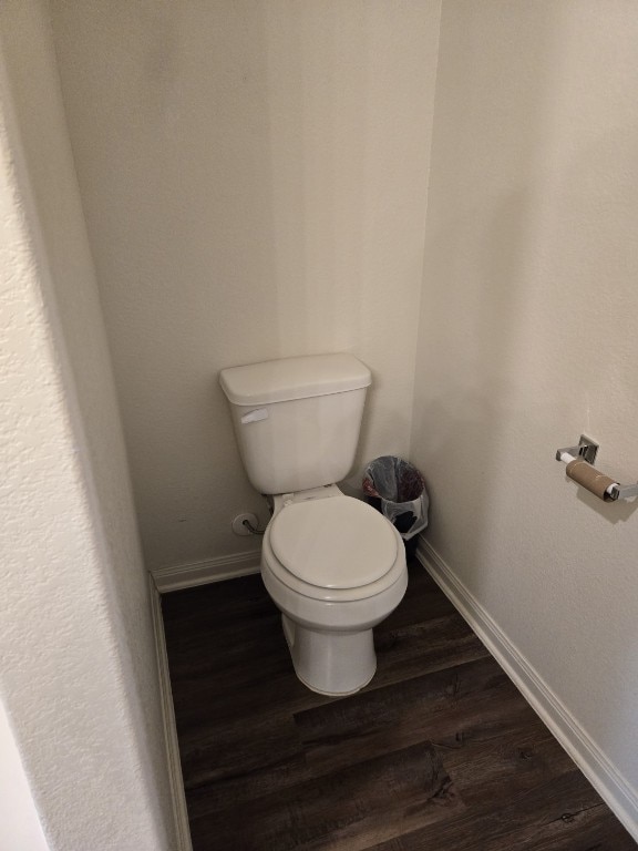 1337 Violet Ln, Kyle, TX 78640 - bathroom with toilet, wood finished floors, and baseboards