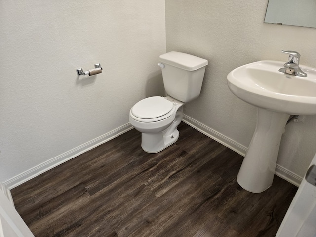 1337 Violet Ln, Kyle, TX 78640 - half bathroom with toilet, wood finished floors, and baseboards