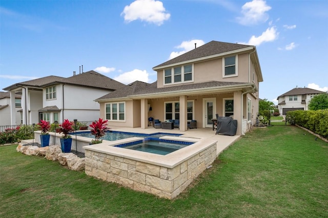 1728 Siena Sunset Rd, Leander, TX 78641 - back of house featuring an in ground hot tub, an outdoor living space, a patio area, a yard, and stucco siding