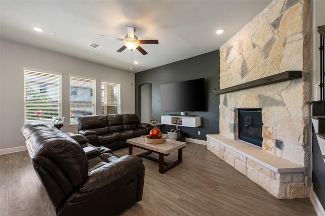 1728 Siena Sunset Rd, Leander, TX 78641 - living area with baseboards, ceiling fan, a fireplace, and wood finished floors