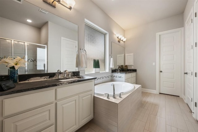 1728 Siena Sunset Rd, Leander, TX 78641 - full bathroom with a shower stall, vanity, and a bath