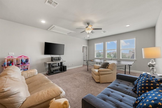 1728 Siena Sunset Rd, Leander, TX 78641 - carpeted living room with ceiling fan, visible vents, baseboards, and attic access