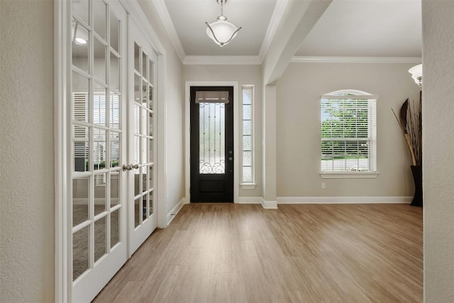 1728 Siena Sunset Rd, Leander, TX 78641 - entrance foyer with baseboards, ornamental molding, french doors, and wood finished floors