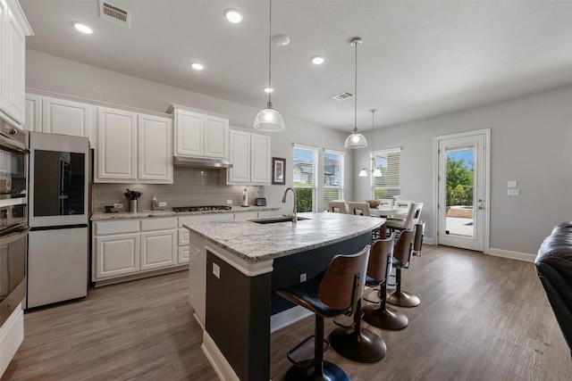1728 Siena Sunset Rd, Leander, TX 78641 - kitchen featuring visible vents, a sink, and white cabinetry