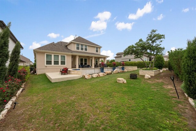 1728 Siena Sunset Rd, Leander, TX 78641 - back of house with a patio, stucco siding, and a yard