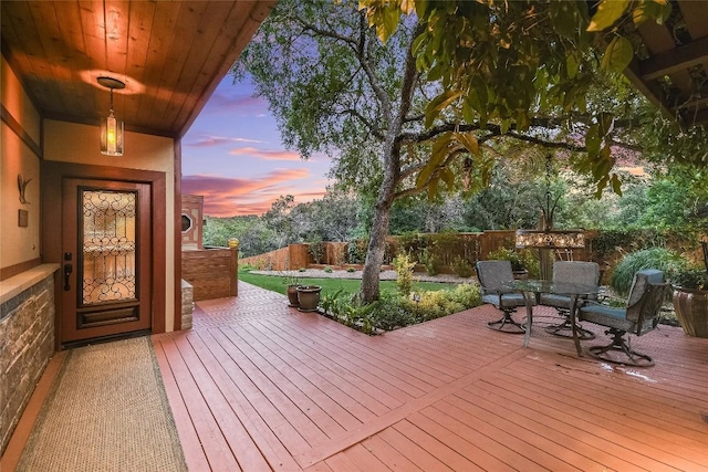 611 N Cuernavaca Dr Unit 301, Austin, TX 78733 - deck at dusk with outdoor dining area and a fenced backyard