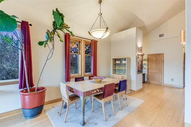 611 N Cuernavaca Dr Unit 301, Austin, TX 78733 - dining area featuring light wood-style flooring and high vaulted ceiling