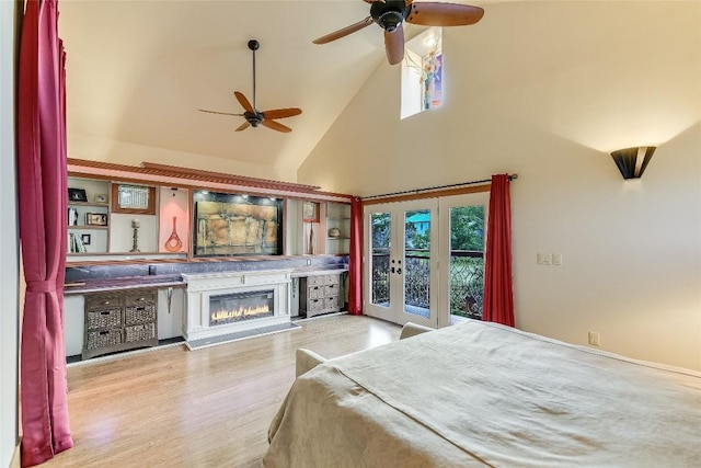 611 N Cuernavaca Dr Unit 301, Austin, TX 78733 - bedroom featuring high vaulted ceiling, french doors, access to exterior, multiple windows, and wood finished floors