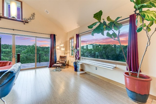 611 N Cuernavaca Dr Unit 301, Austin, TX 78733 - sitting room featuring wood finished floors and lofted ceiling