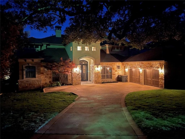 3113 Ski Shores Ter, Austin, TX 78730 - view of front of property with stone siding, driveway, a garage, and stucco siding
