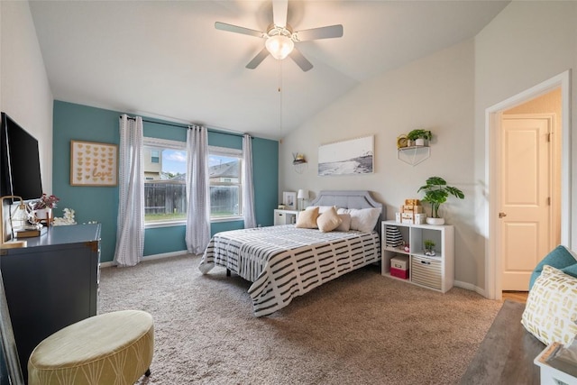 bedroom with baseboards, a ceiling fan, carpet, and vaulted ceiling